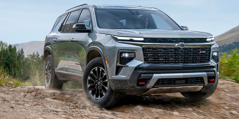 A 2025 Chevrolet Traverse heading over a hill in Newton Falls, OH